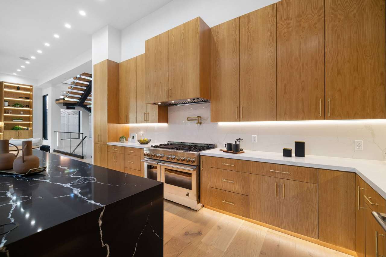Natural wood kitchen range wall cabinetry by Millwork USA in Los Angeles California