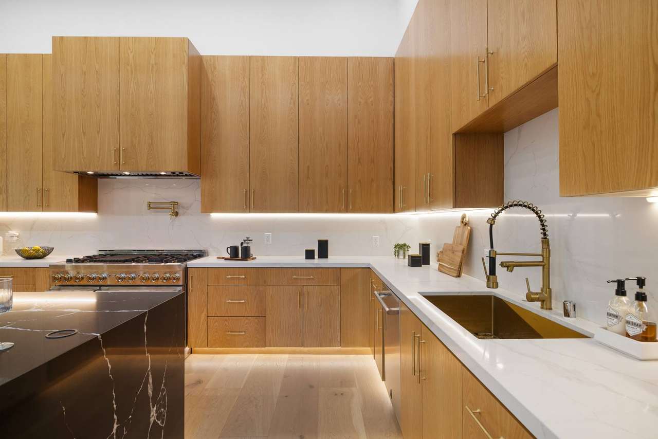 Los Angeles custom kitchen sink wall cabinetry with integrated task lighting