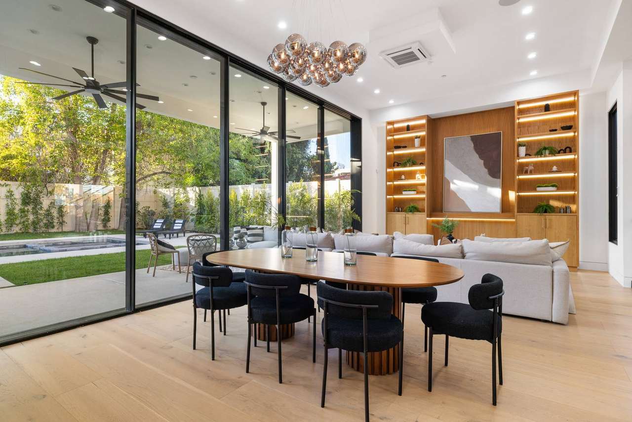 Los Angeles dining and living area with illuminated architectural millwork by Millwork USA