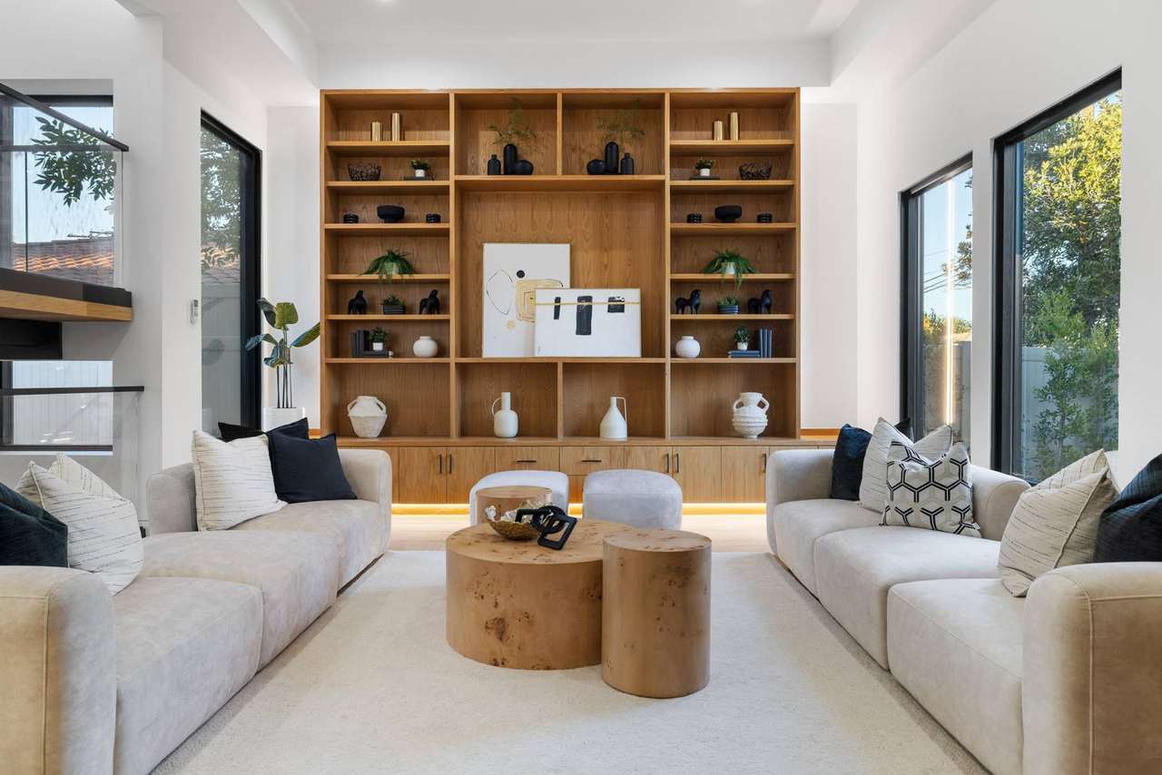 Floor-to-ceiling custom library wall and cabinetry by Millwork USA in Los Angeles