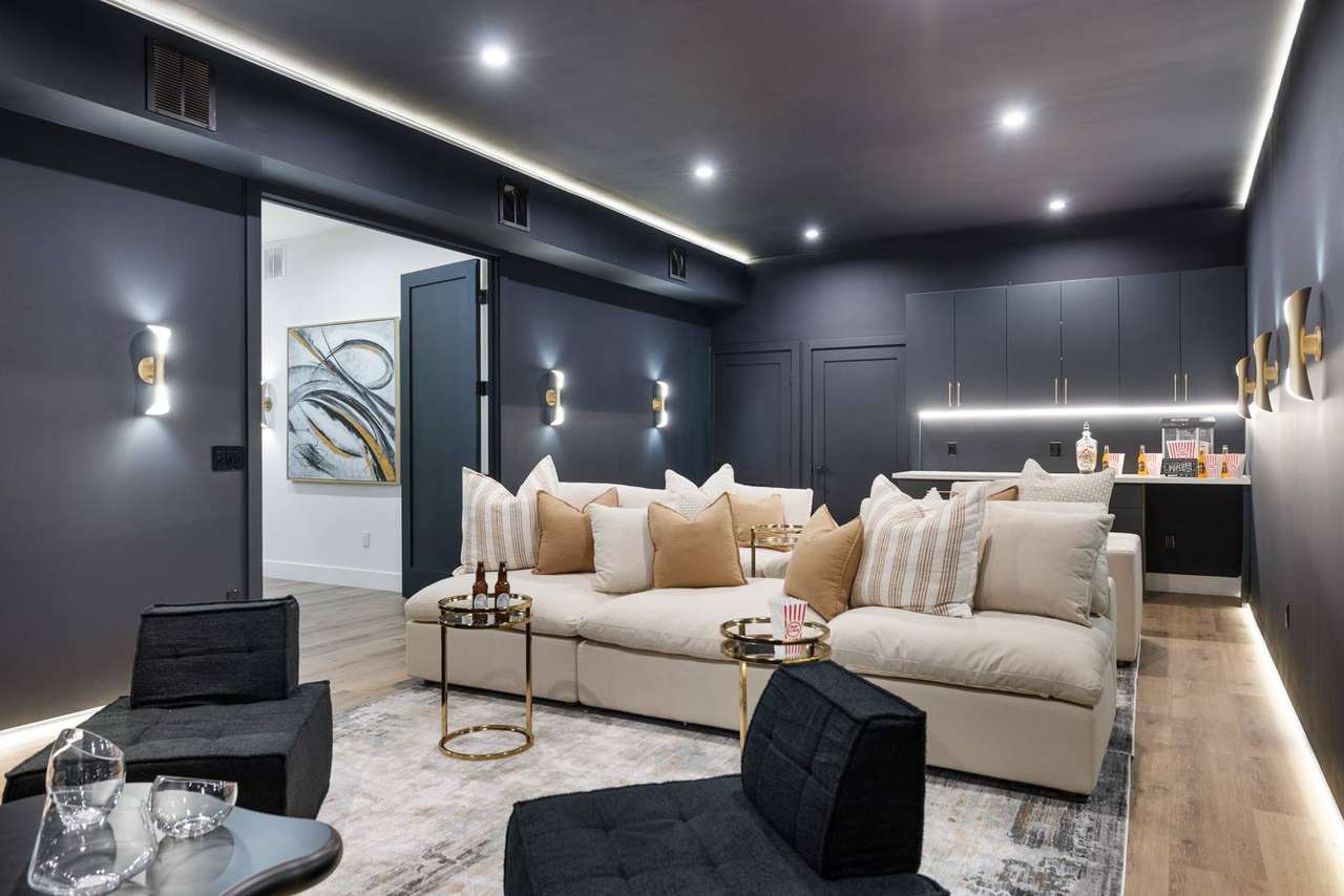Los Angeles media room with custom dark cabinetry by Millwork USA